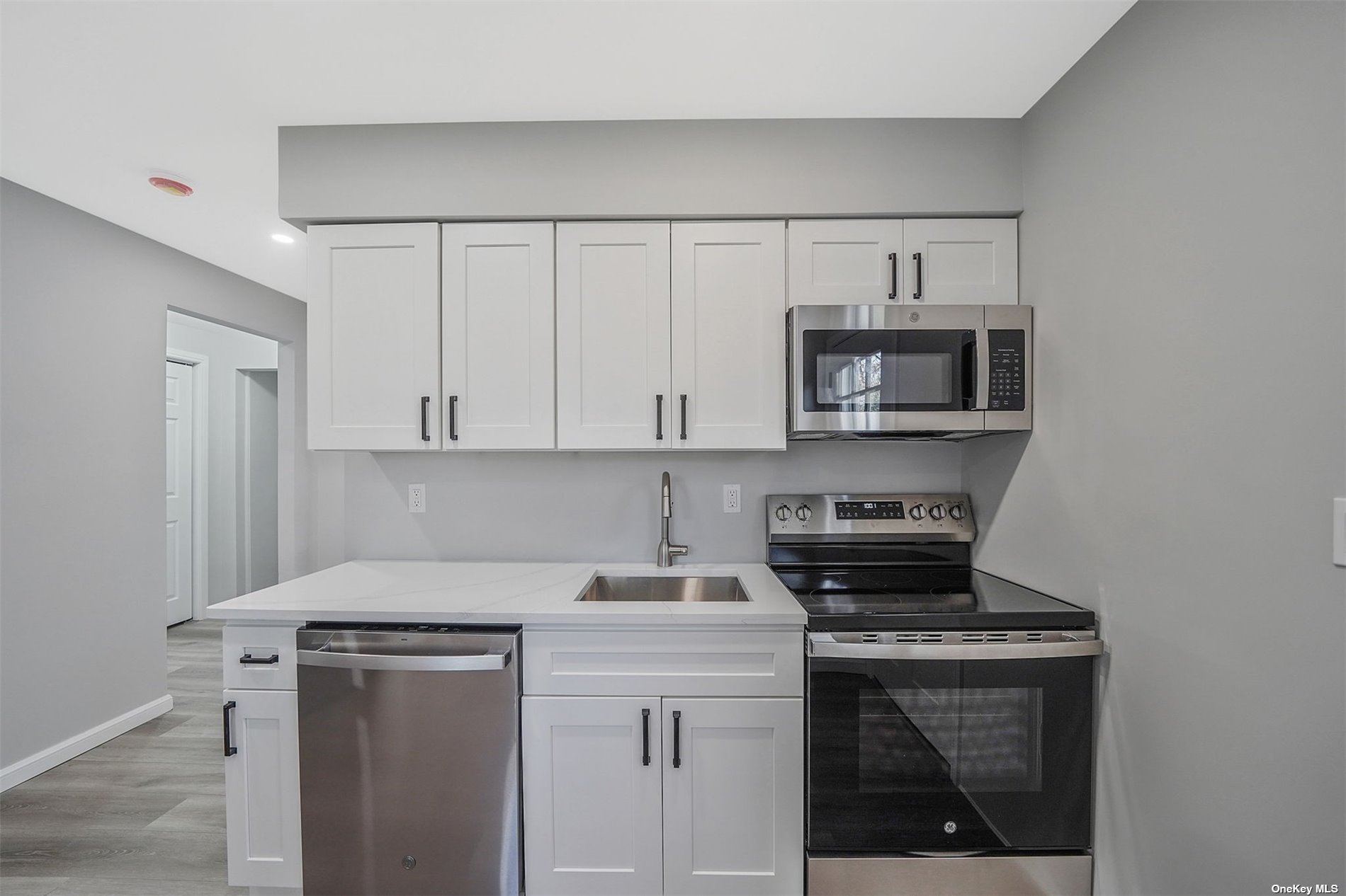 a kitchen with a stove and a microwave