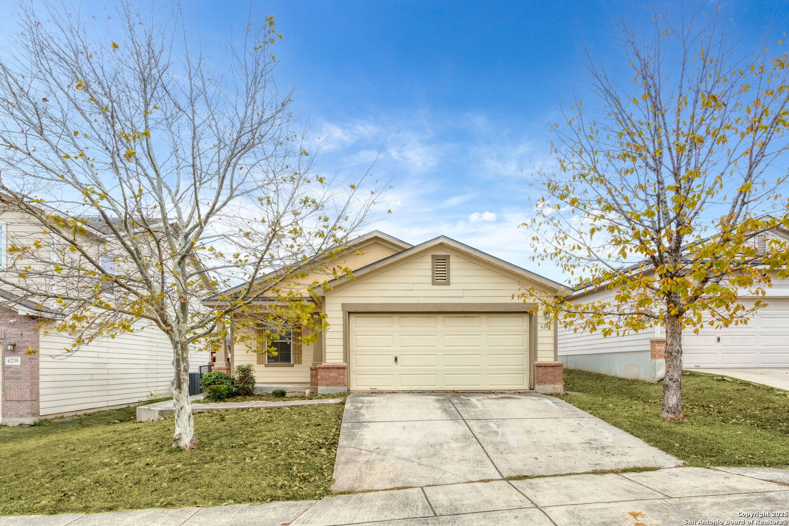 front view of a house with a yard