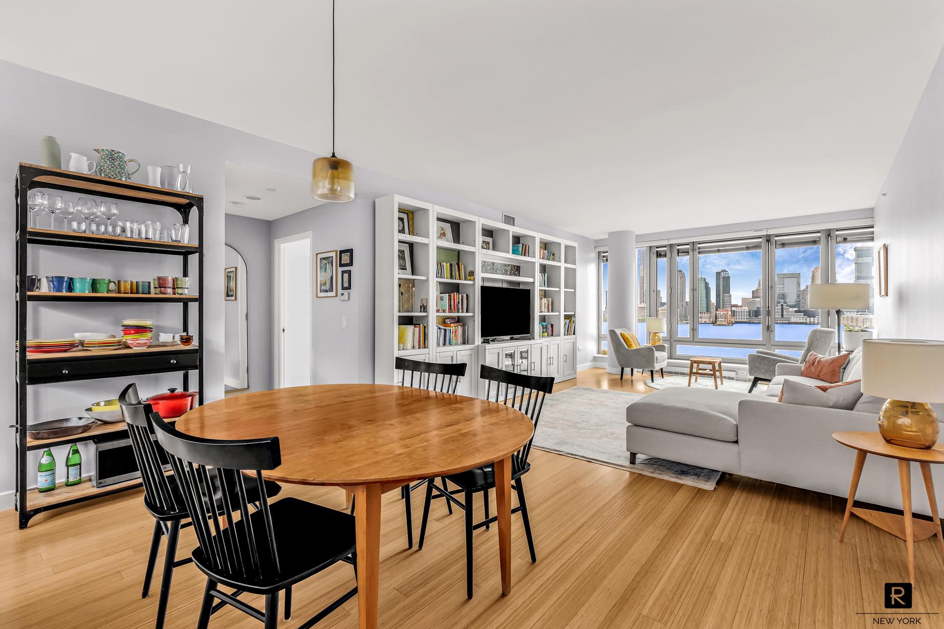 a view of a dining room with furniture window and wooden floor