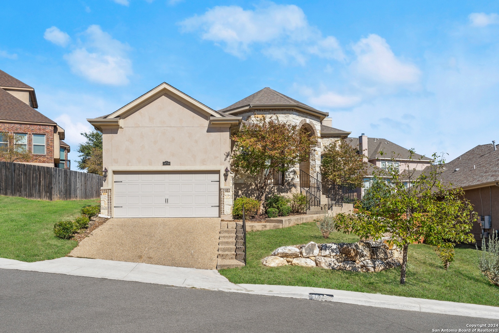 a front view of a house with garden