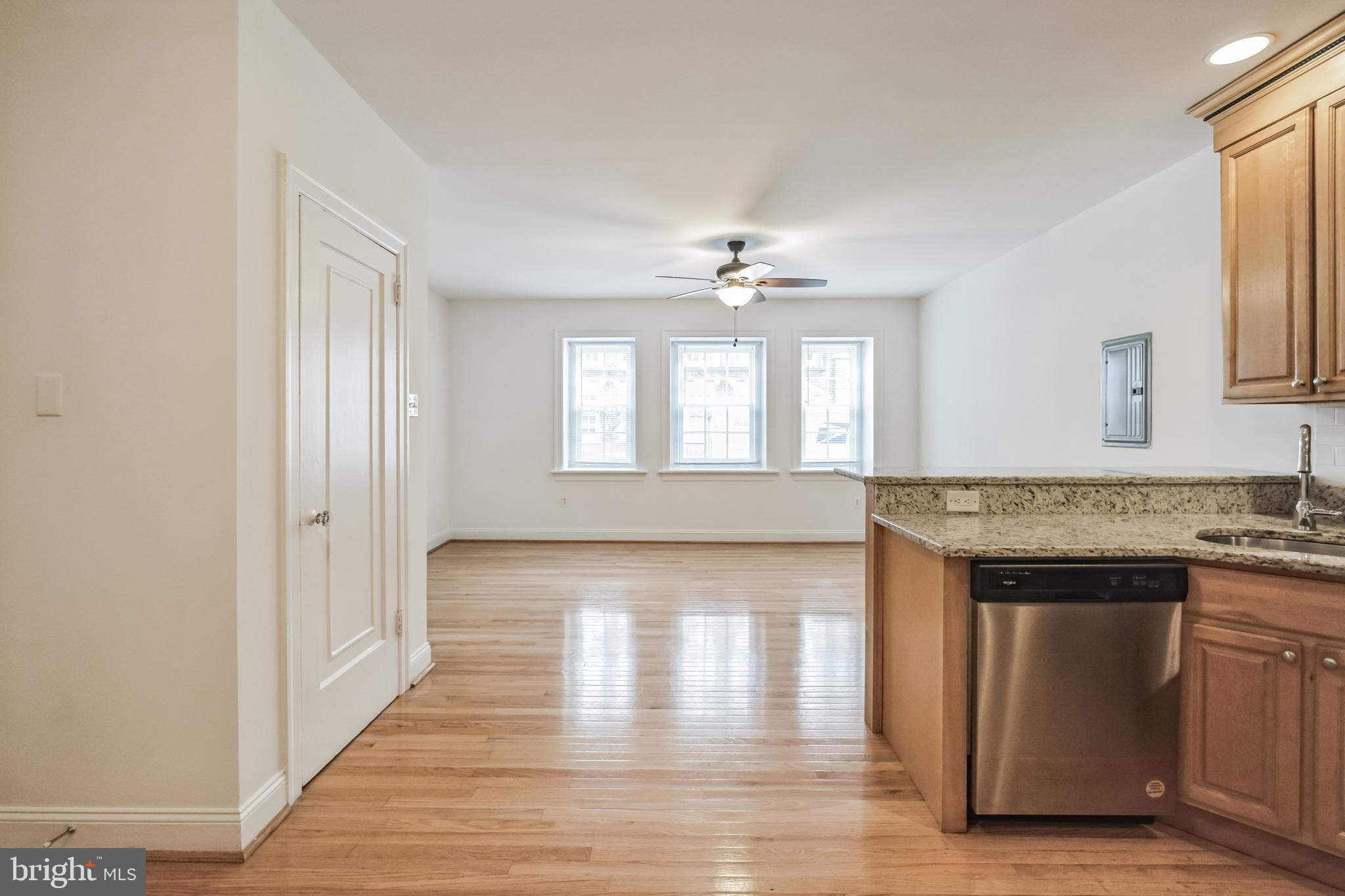 a view of a kitchen from the hallway