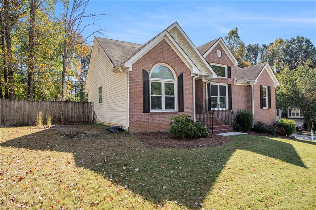 a front view of a house with a yard