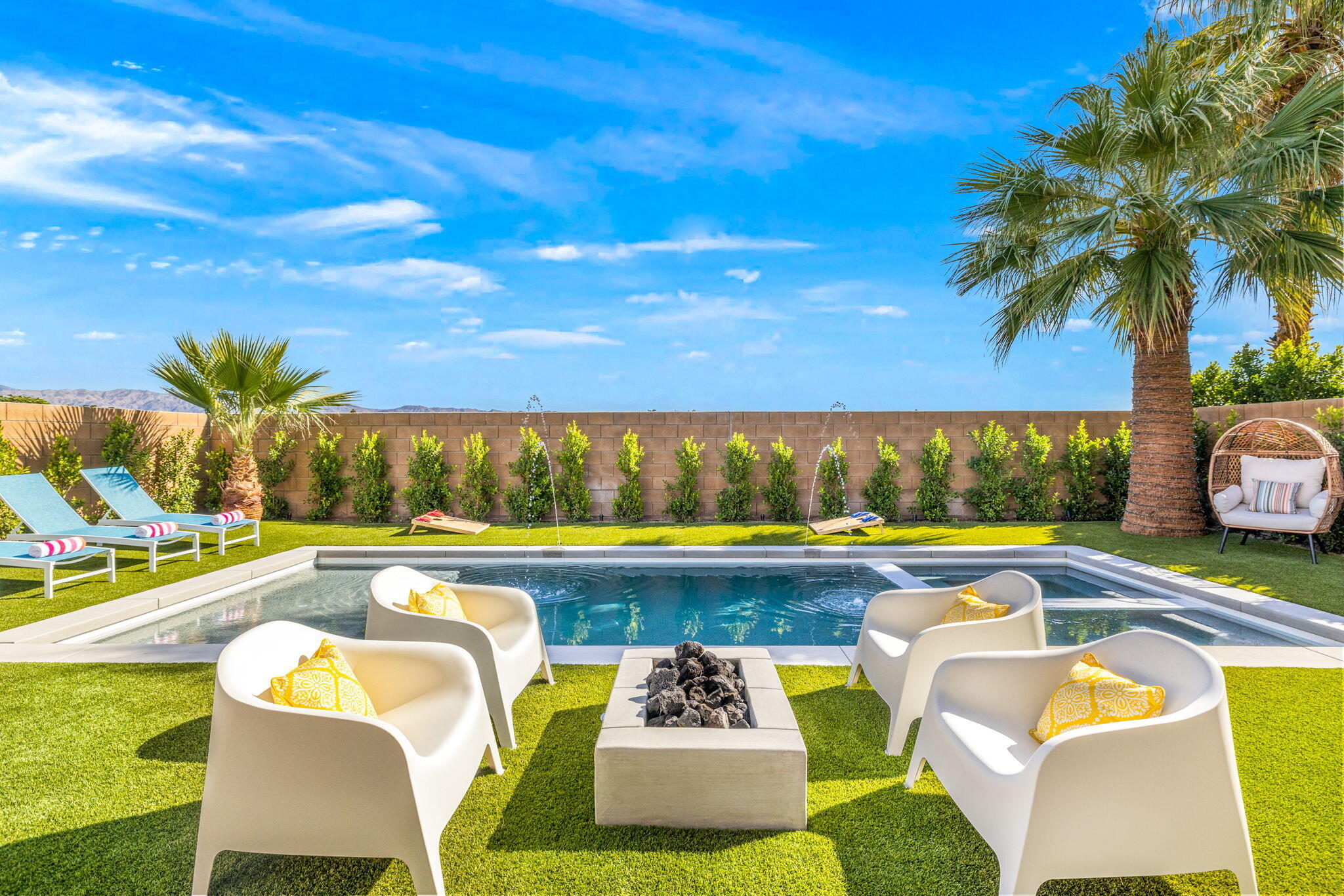 a view of a swimming pool and lounge chair