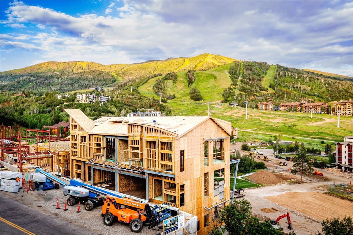 a view of a big building next to a road