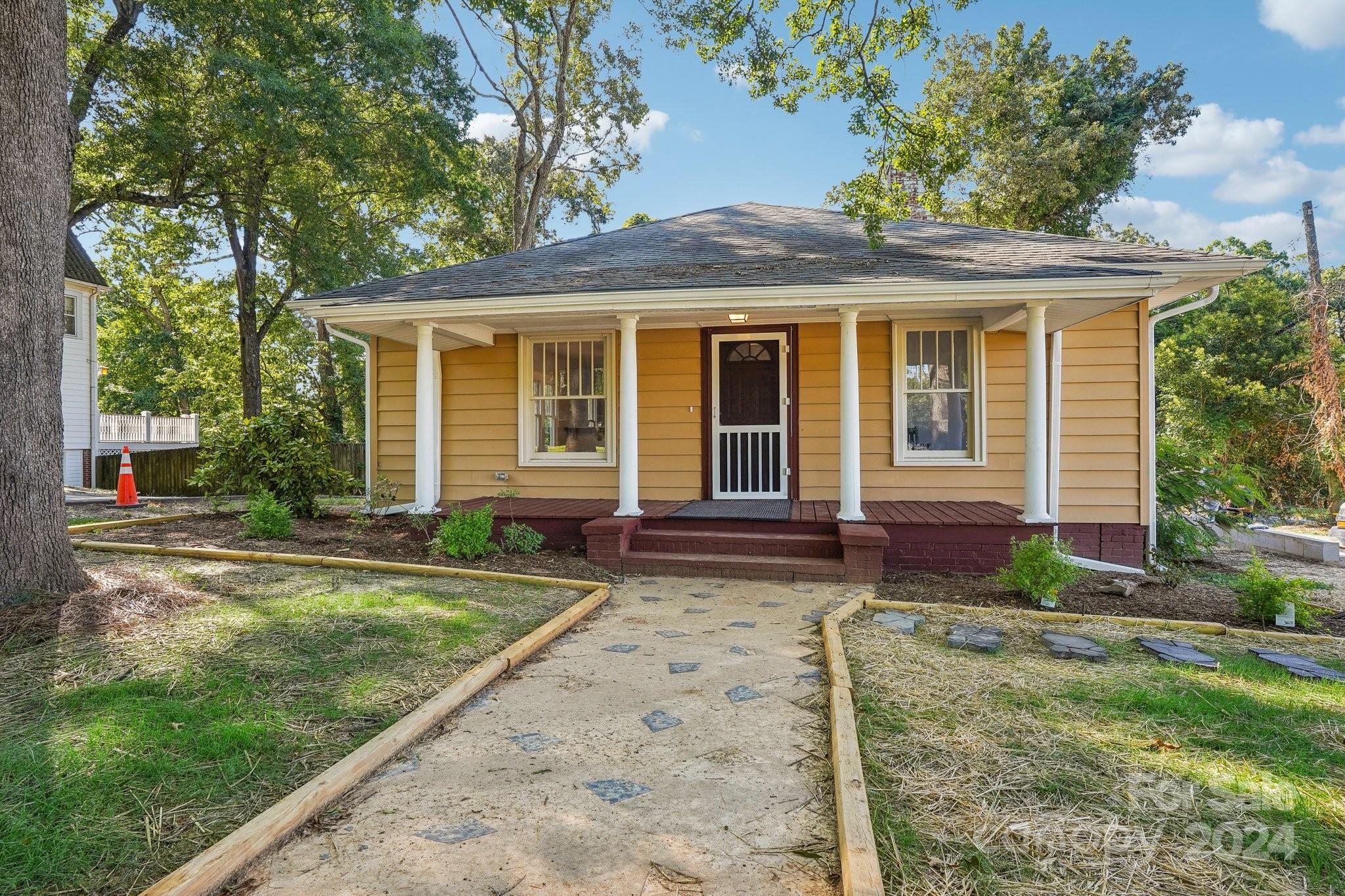 front view of a house with a yard