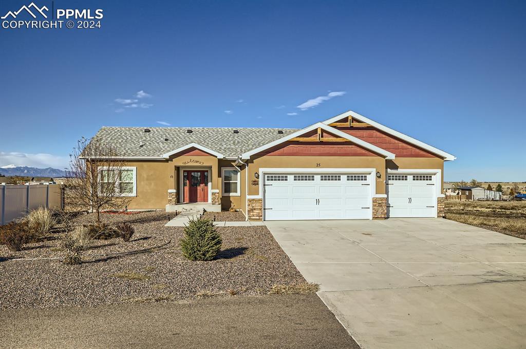 Craftsman house featuring a mountain view and a garage