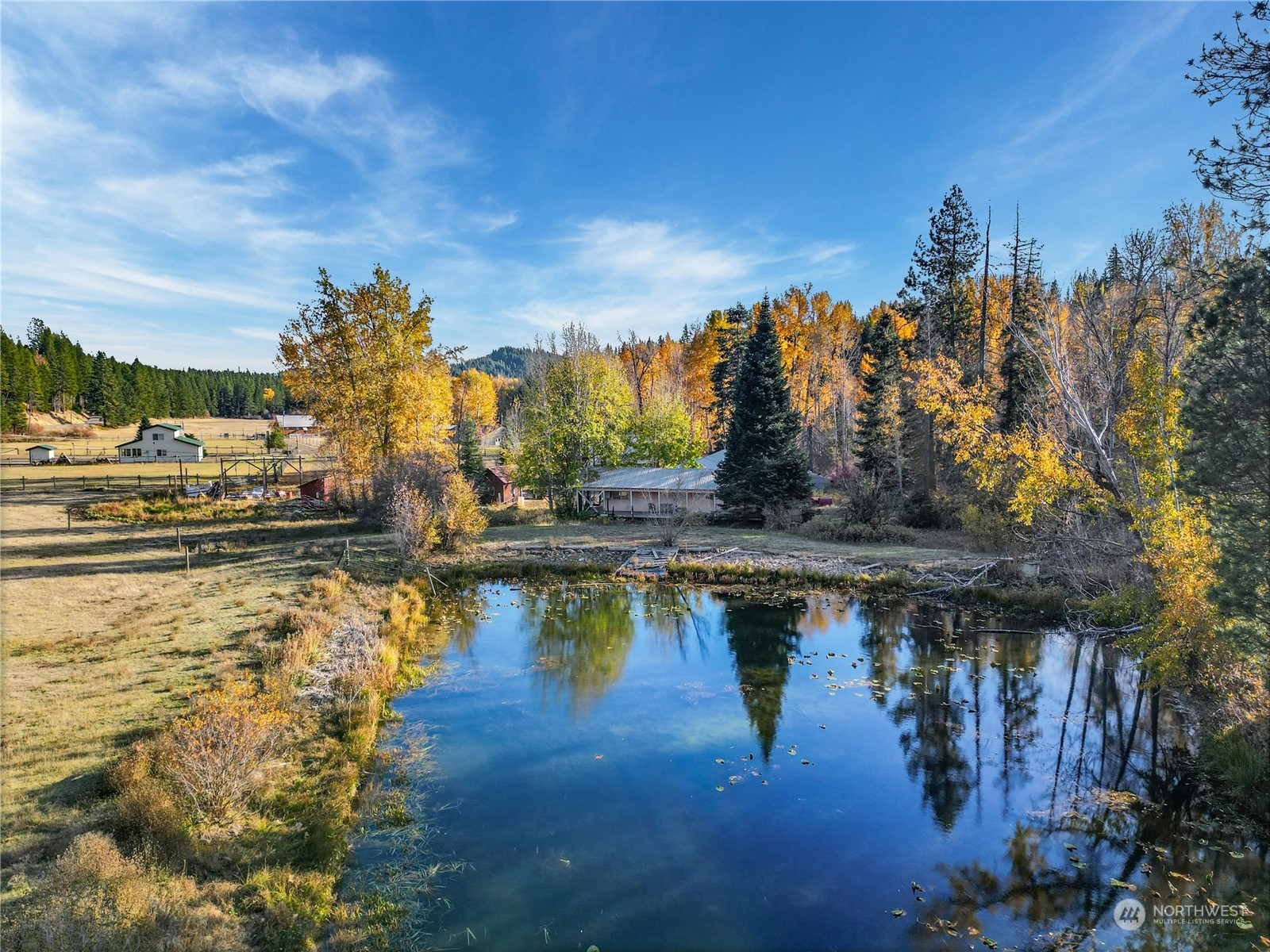 a view of a lake with a house in the background