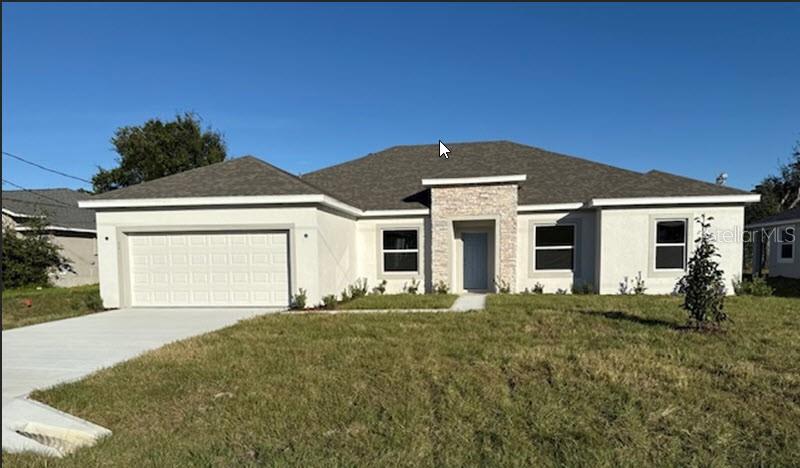 a front view of a house with a yard