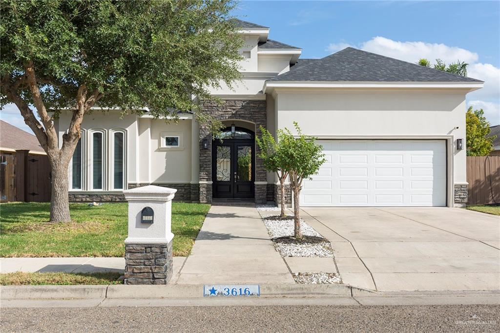 front view of a house with a yard