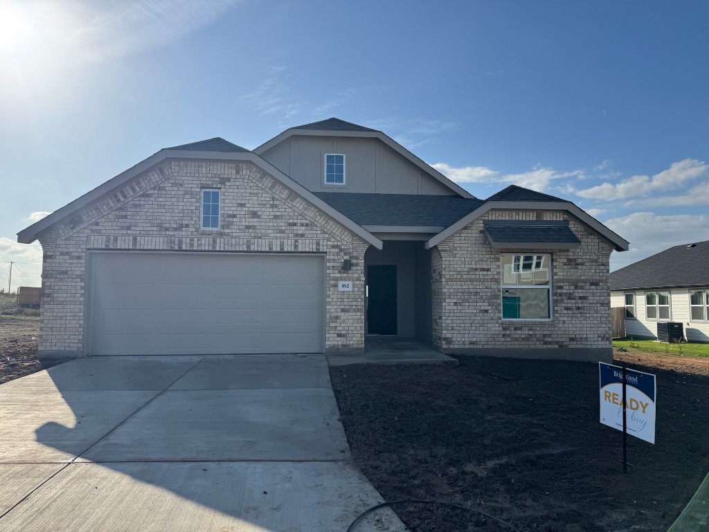 a front view of a house with yard