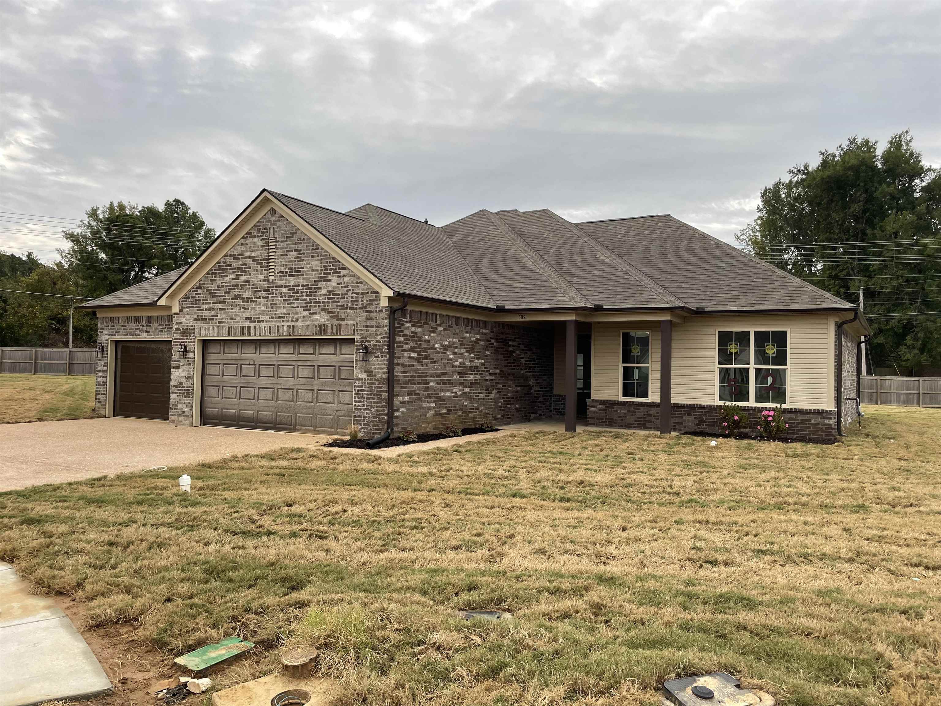 a front view of a house with a yard