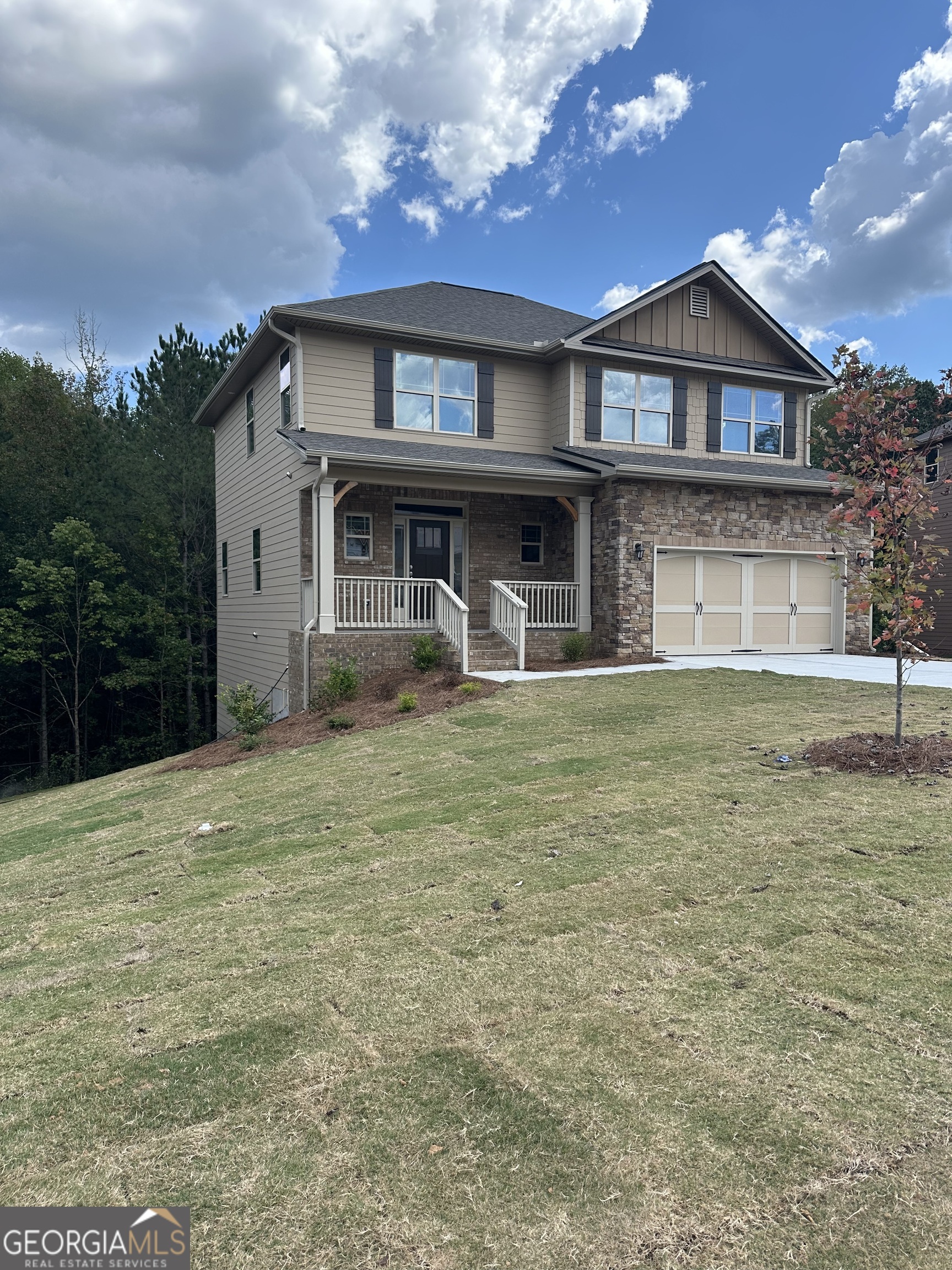 a front view of a house with a yard