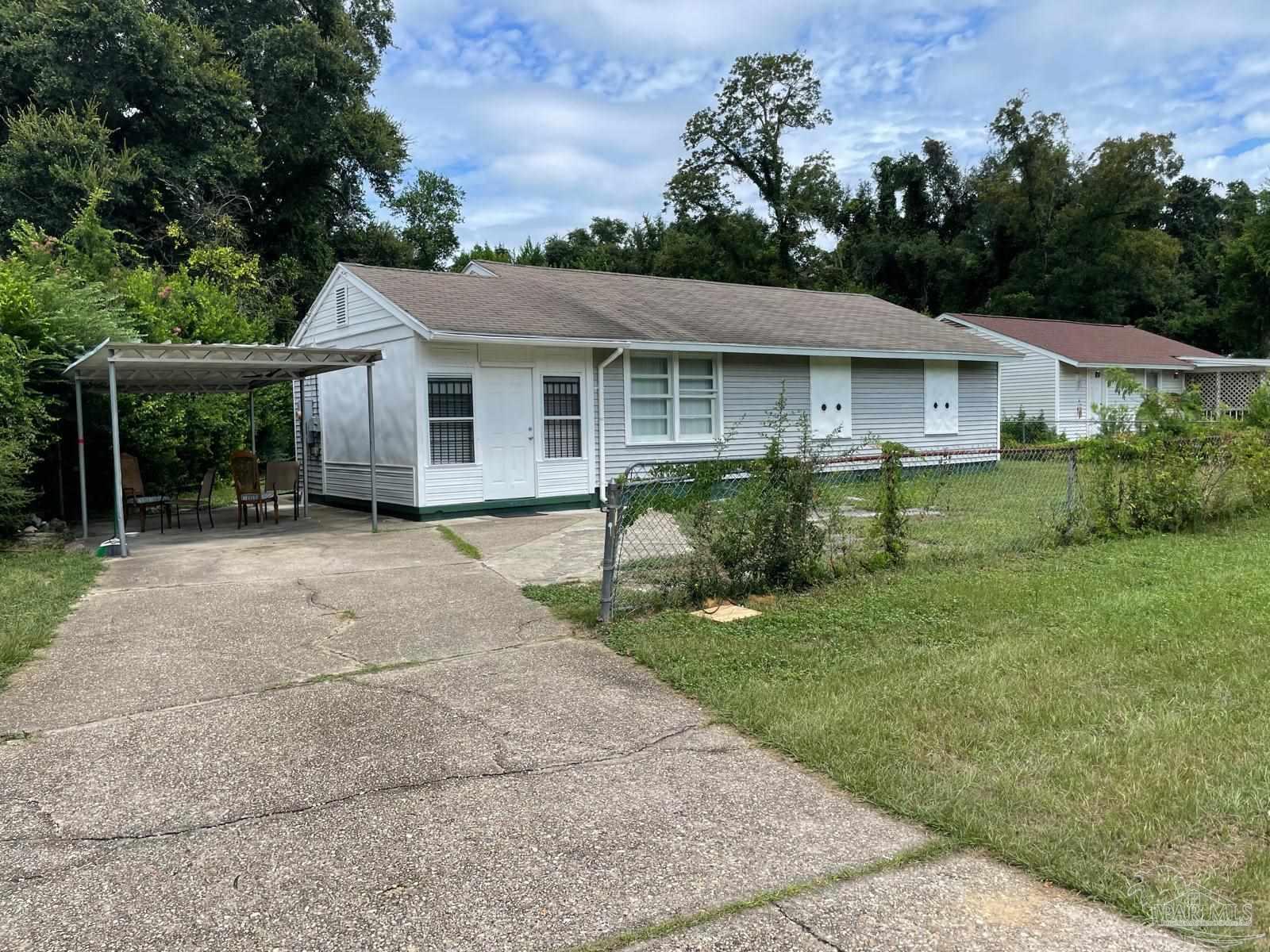 front view of a house with a yard