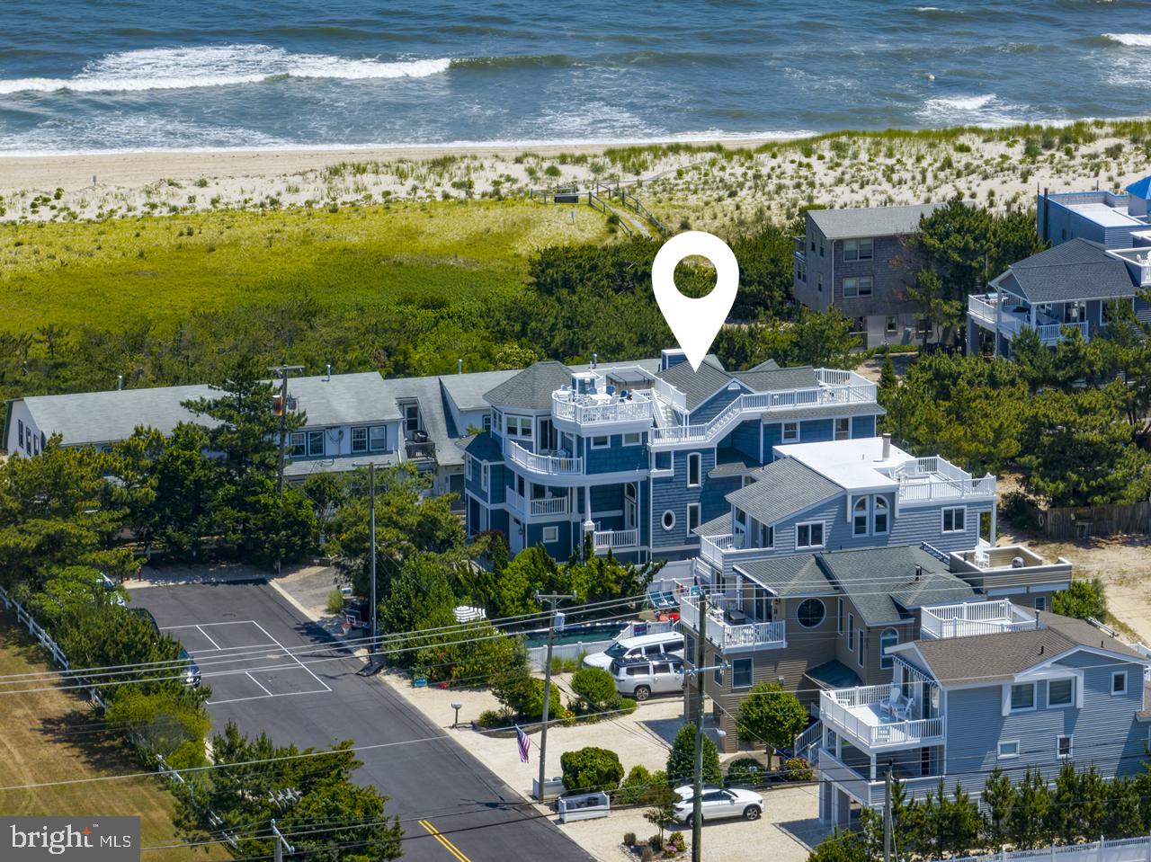 a aerial view of a house with a swimming pool outdoor seating and yard