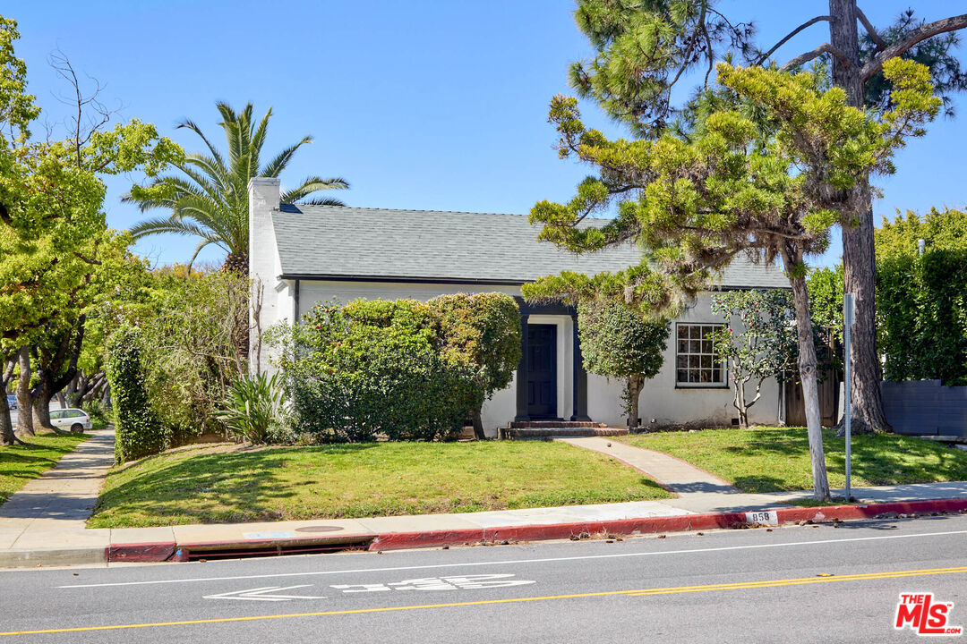 a view of a house with a small garden