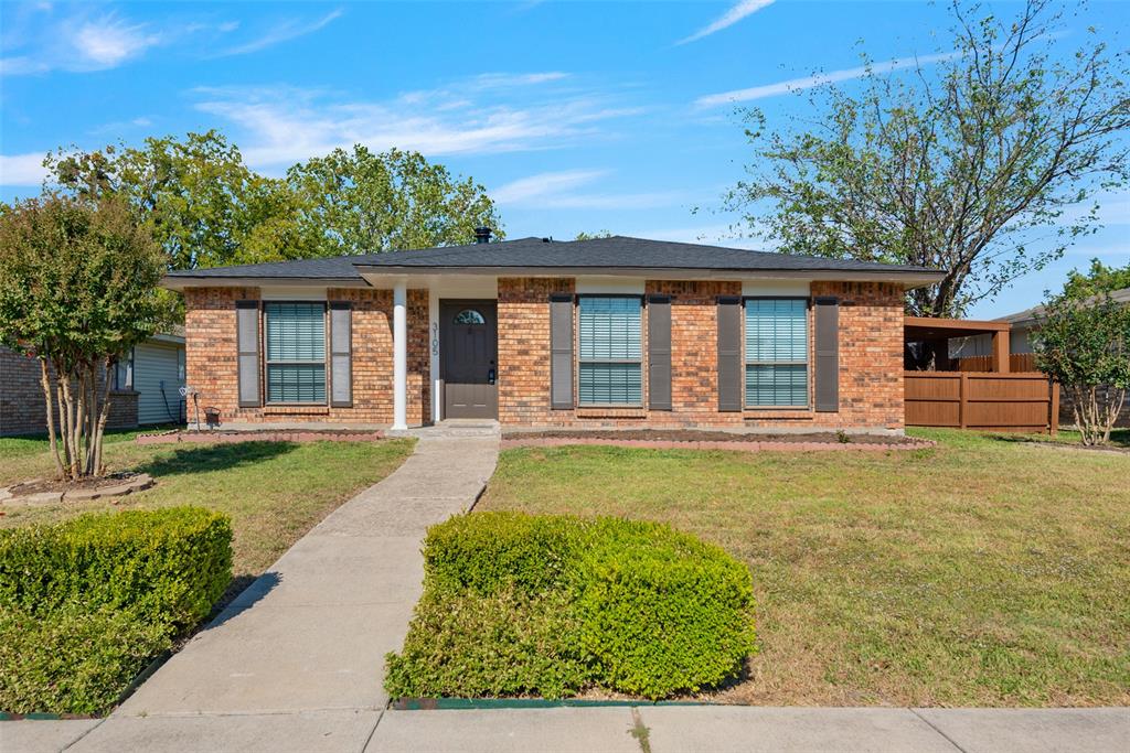 front view of a house with a yard