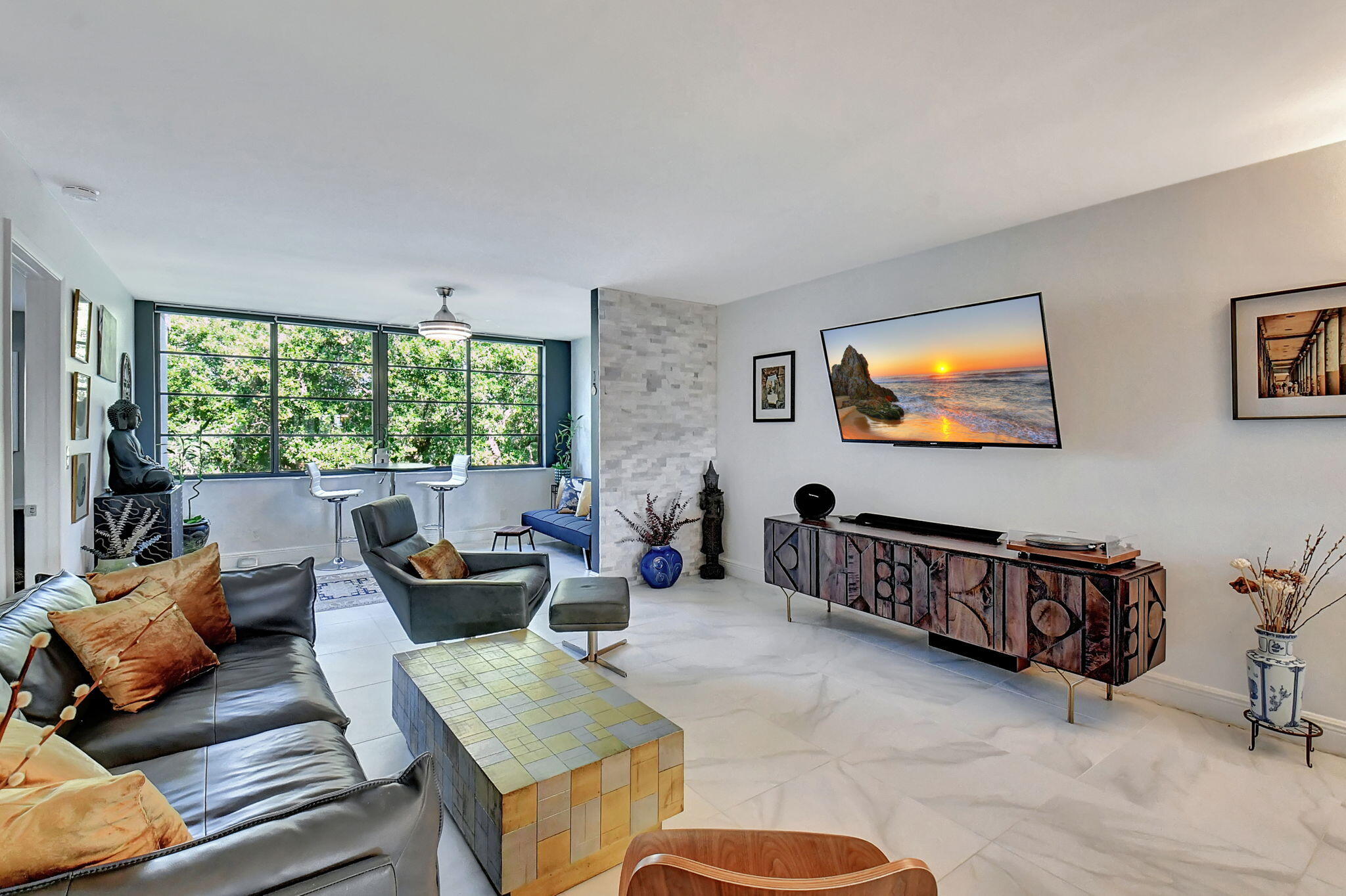 a living room with furniture and a flat screen tv