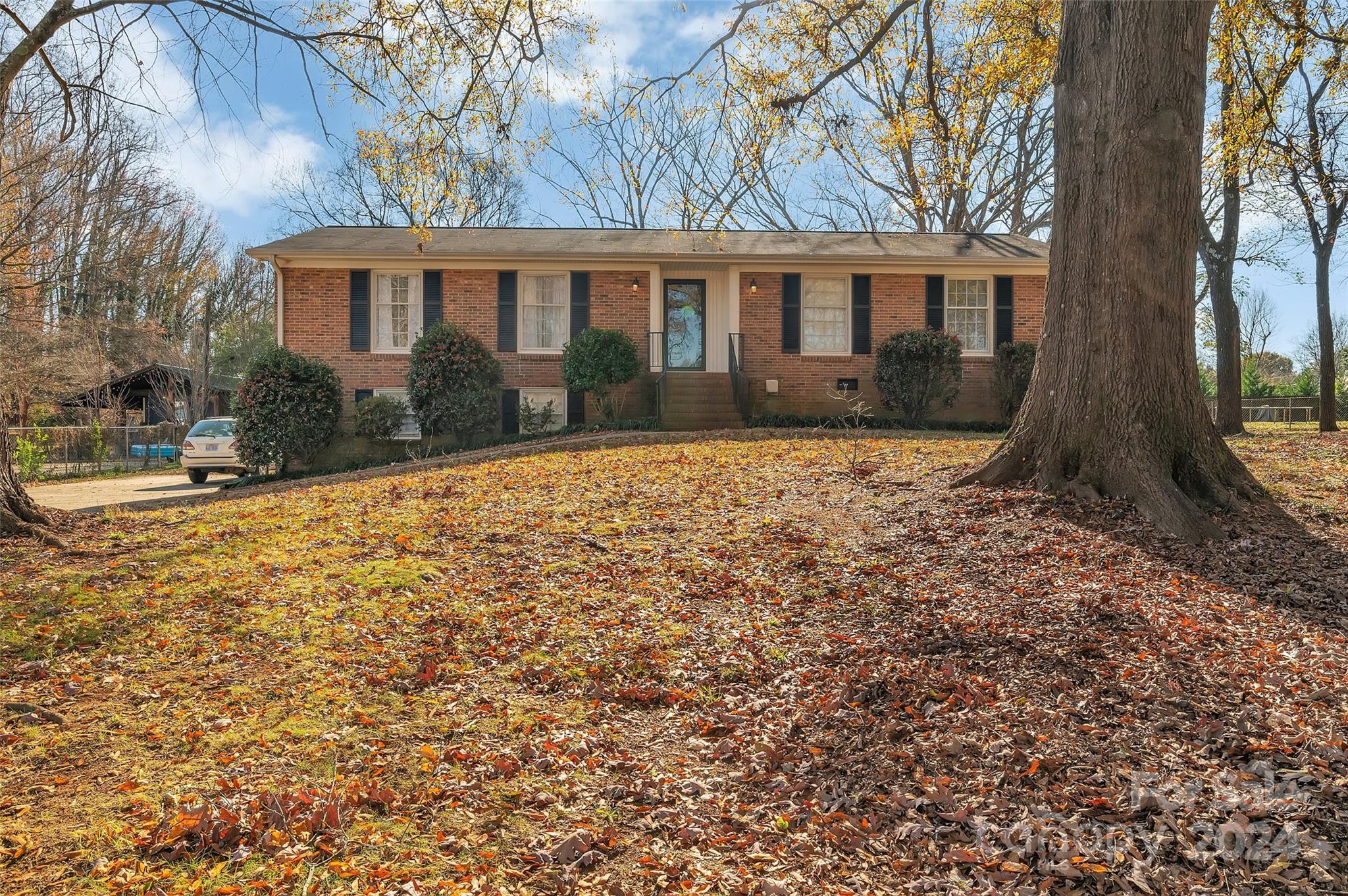 a view of house with yard