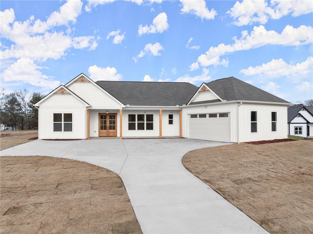 a view of house with a yard