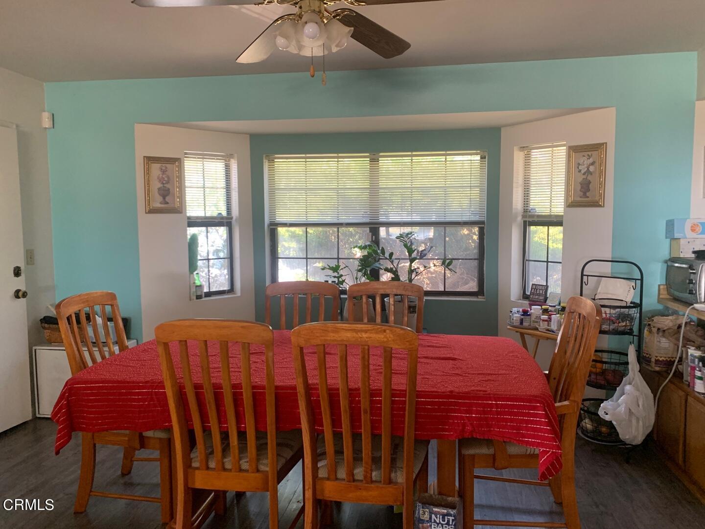 a dining room with furniture and window