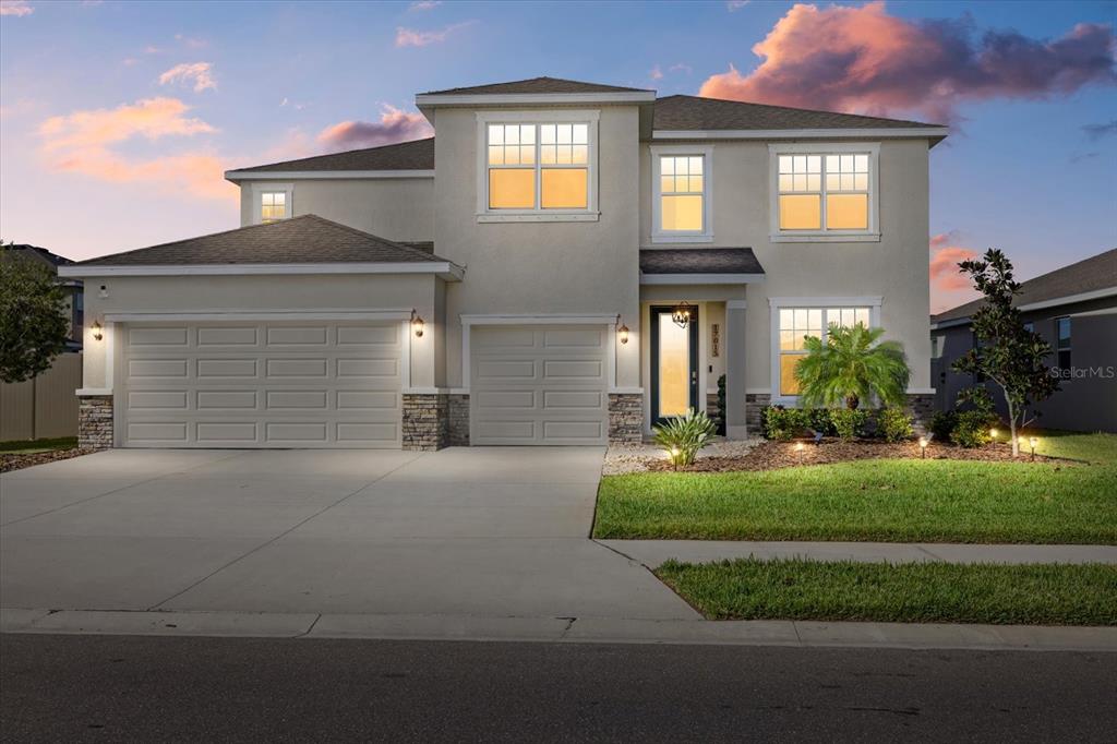 a front view of a house with a yard