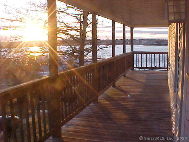 a view of balcony with wooden floor