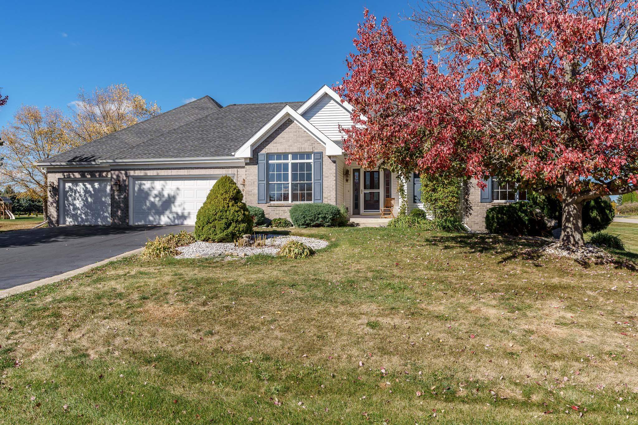 a view of a house with a yard