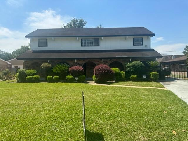 a front view of house with yard and outdoor seating