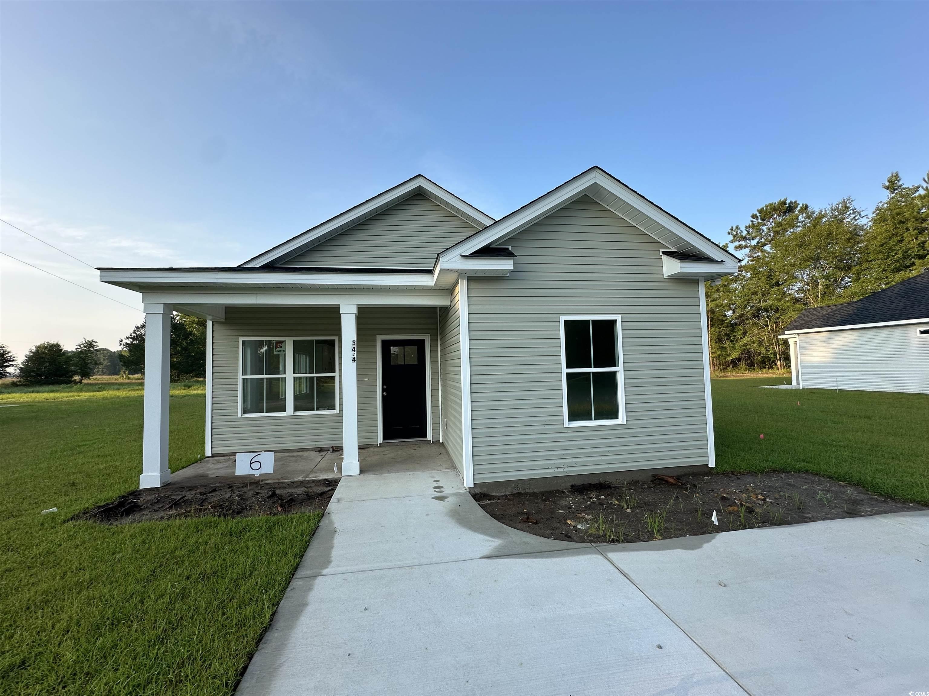 View of front of property with a front lawn