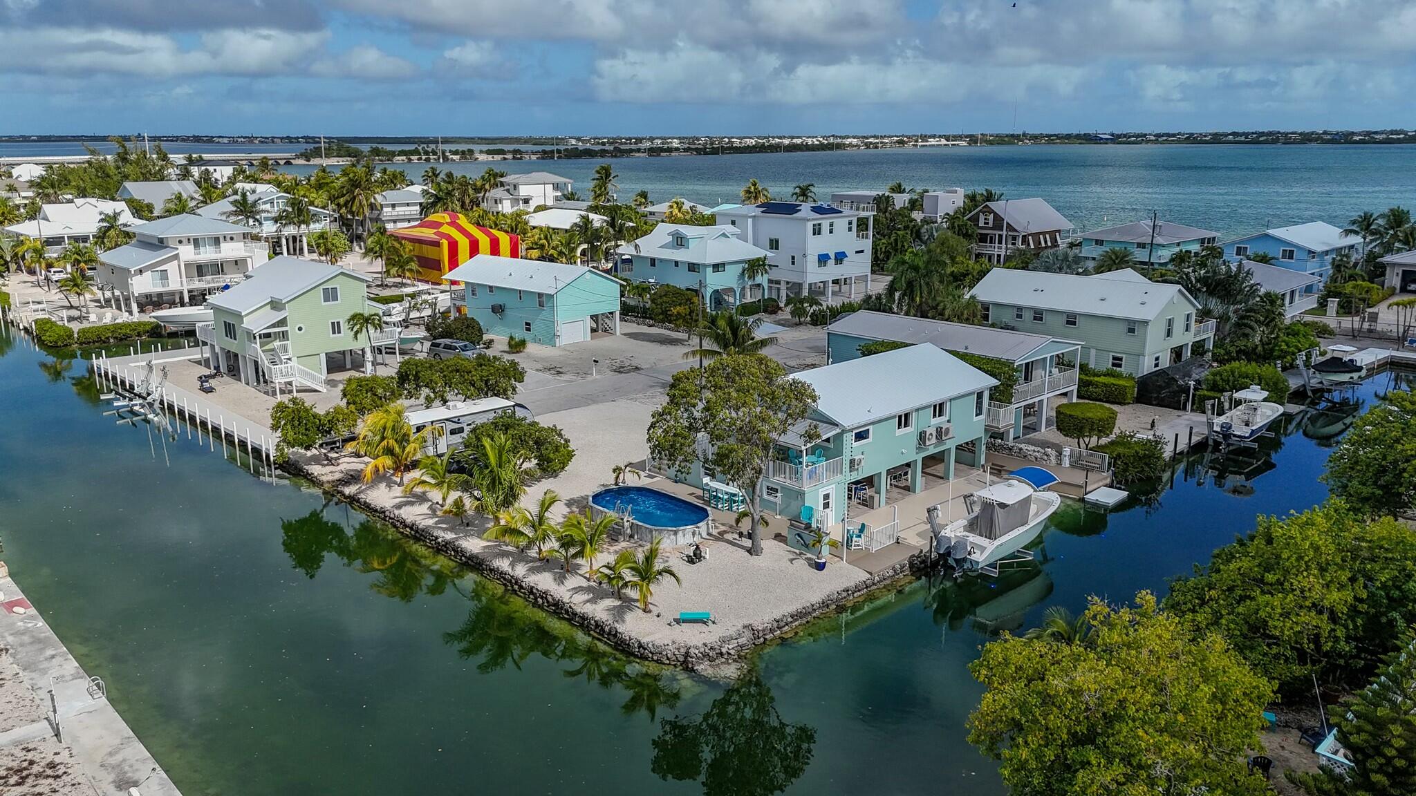 an aerial view of house with yard swimming pool and outdoor seating