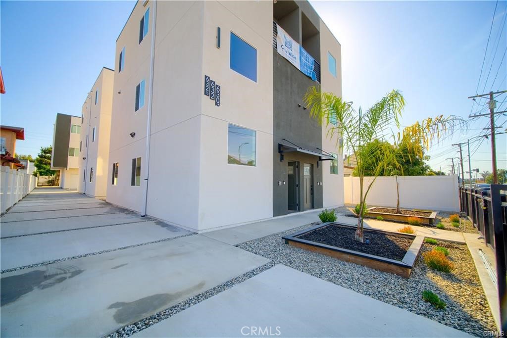 a view of backyard with a patio