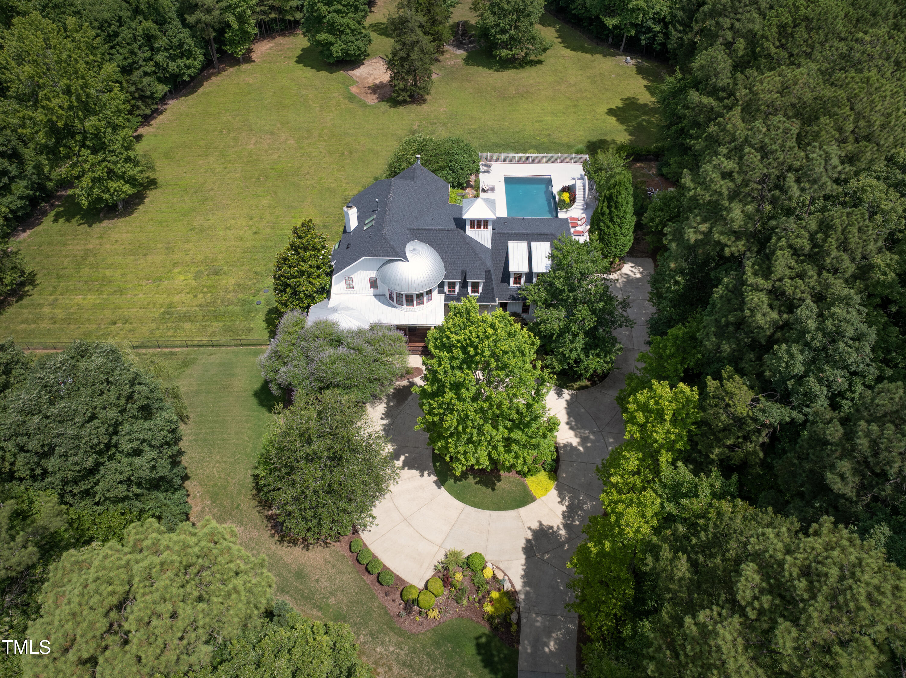 an aerial view of a house with a lake view