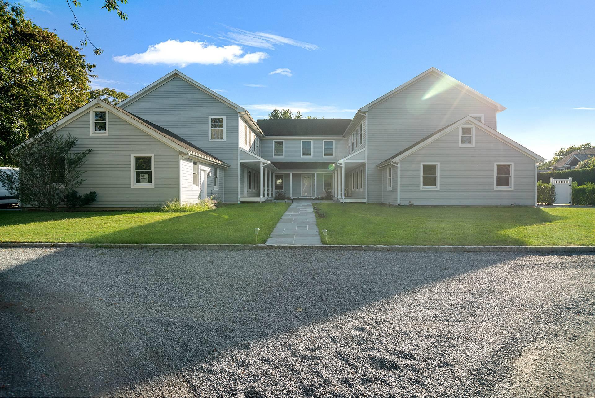 View of front property with a front lawn and a porch