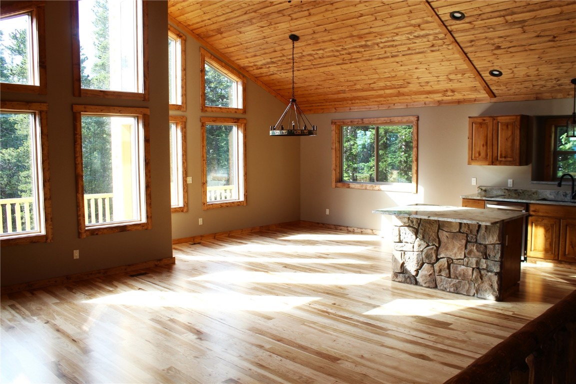 a view of a kitchen with a sink and cabinets