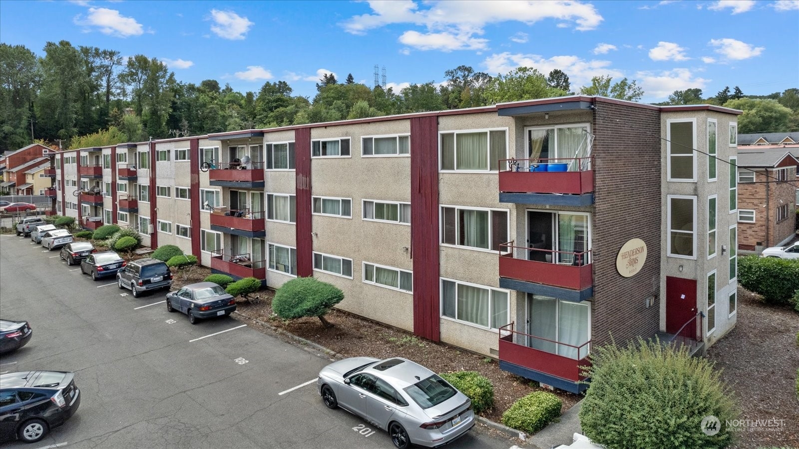 a front view of multi story residential apartment building with yard