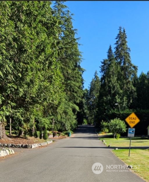 a street sign on a side of a road