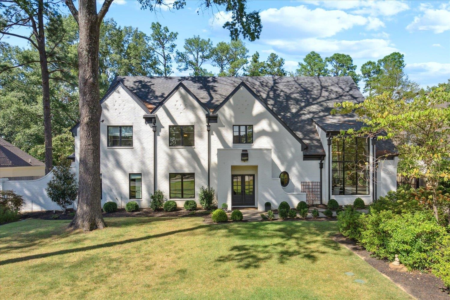 a house with trees in the background