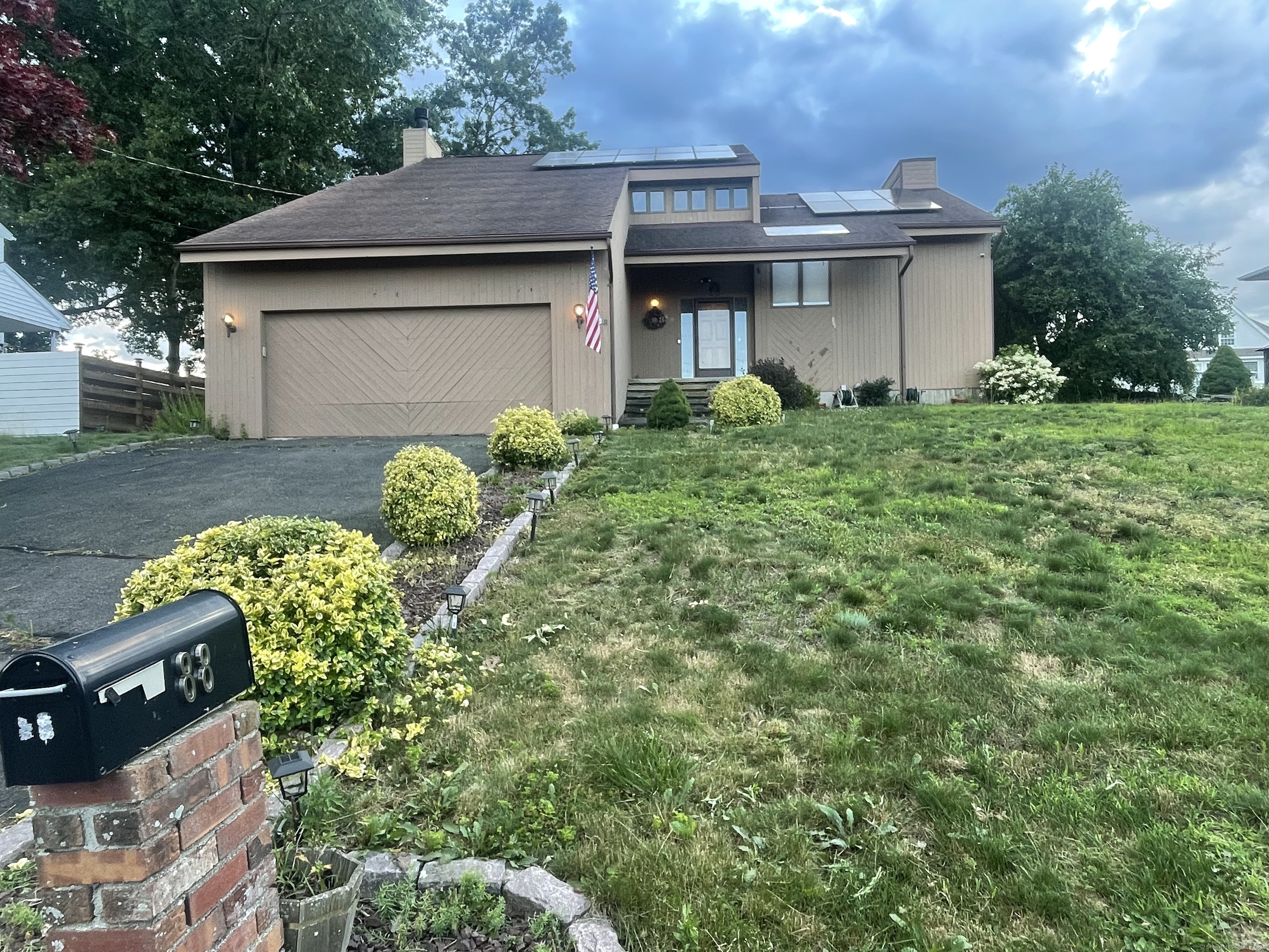 a front view of a house with garden