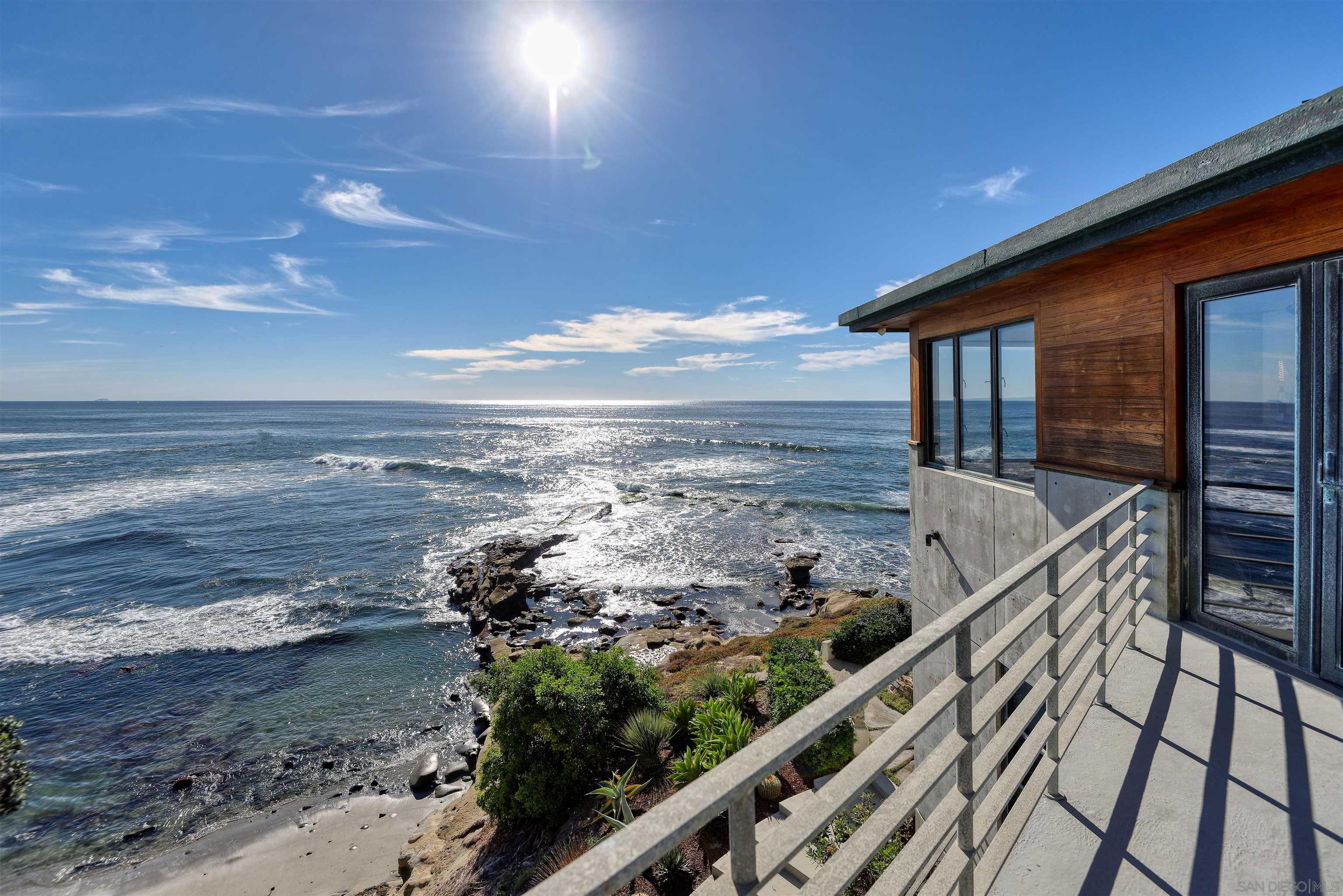 a view of a balcony with an ocean view