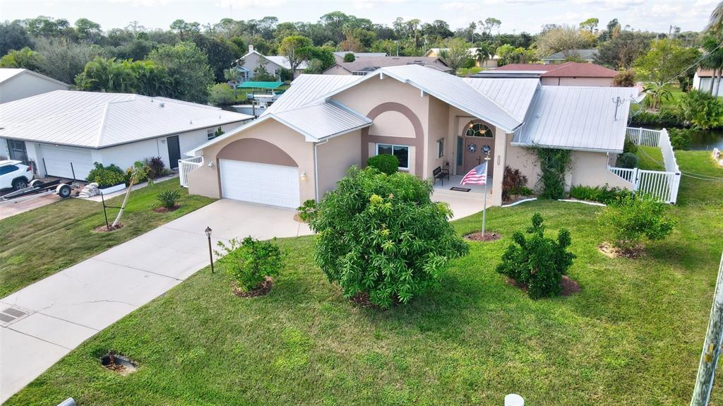 a aerial view of a house with a garden and plants