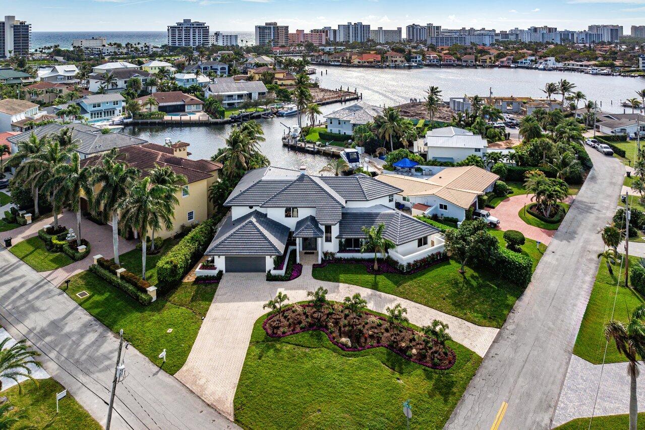 a picture of houses with outdoor space and lake view