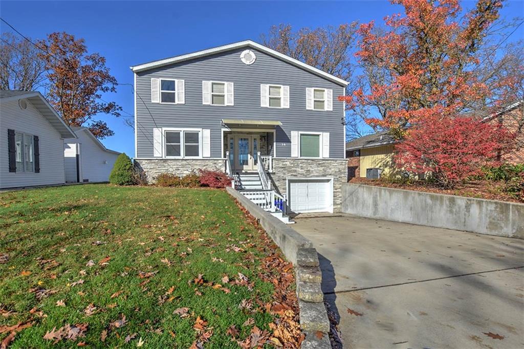 a front view of house with yard