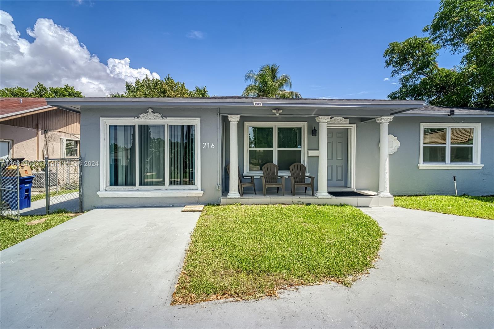 front view of a house with a yard