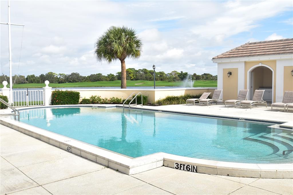 a view of swimming pool from a balcony