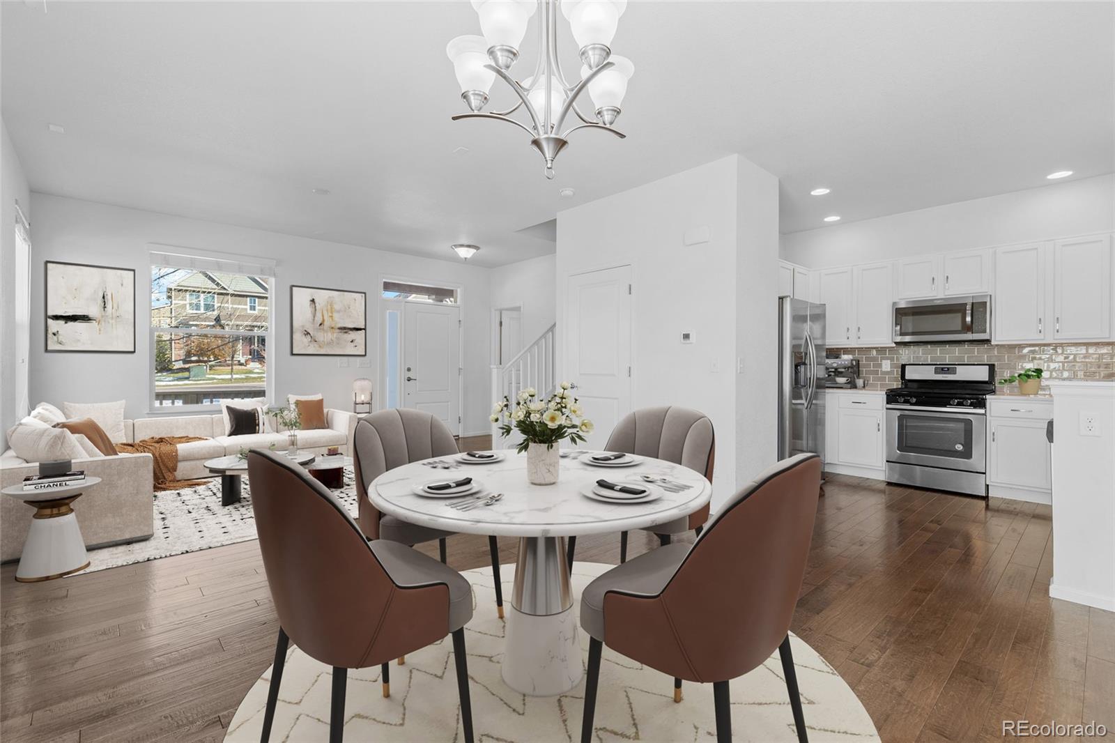 a view of a dining room with furniture window and wooden floor