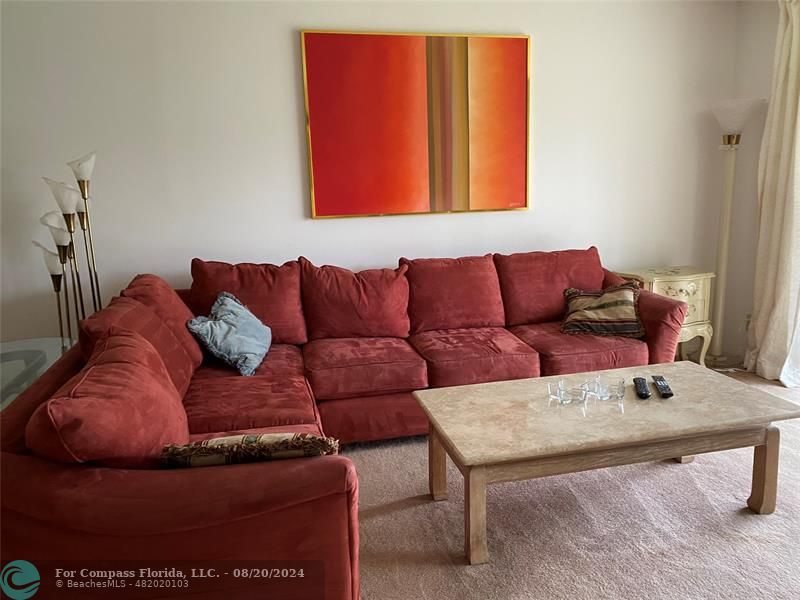 a living room with furniture and a couch