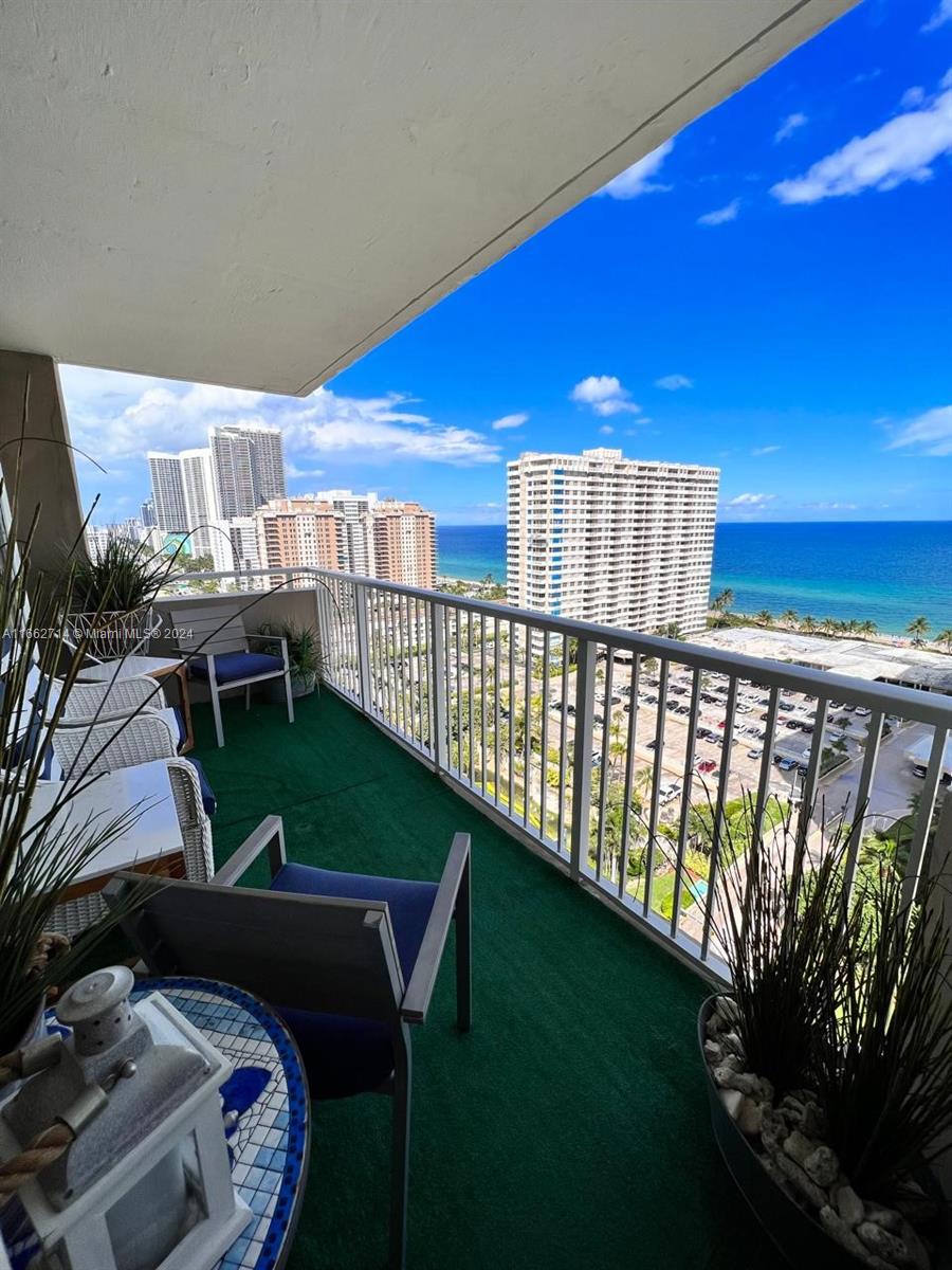 a view of a balcony with chairs