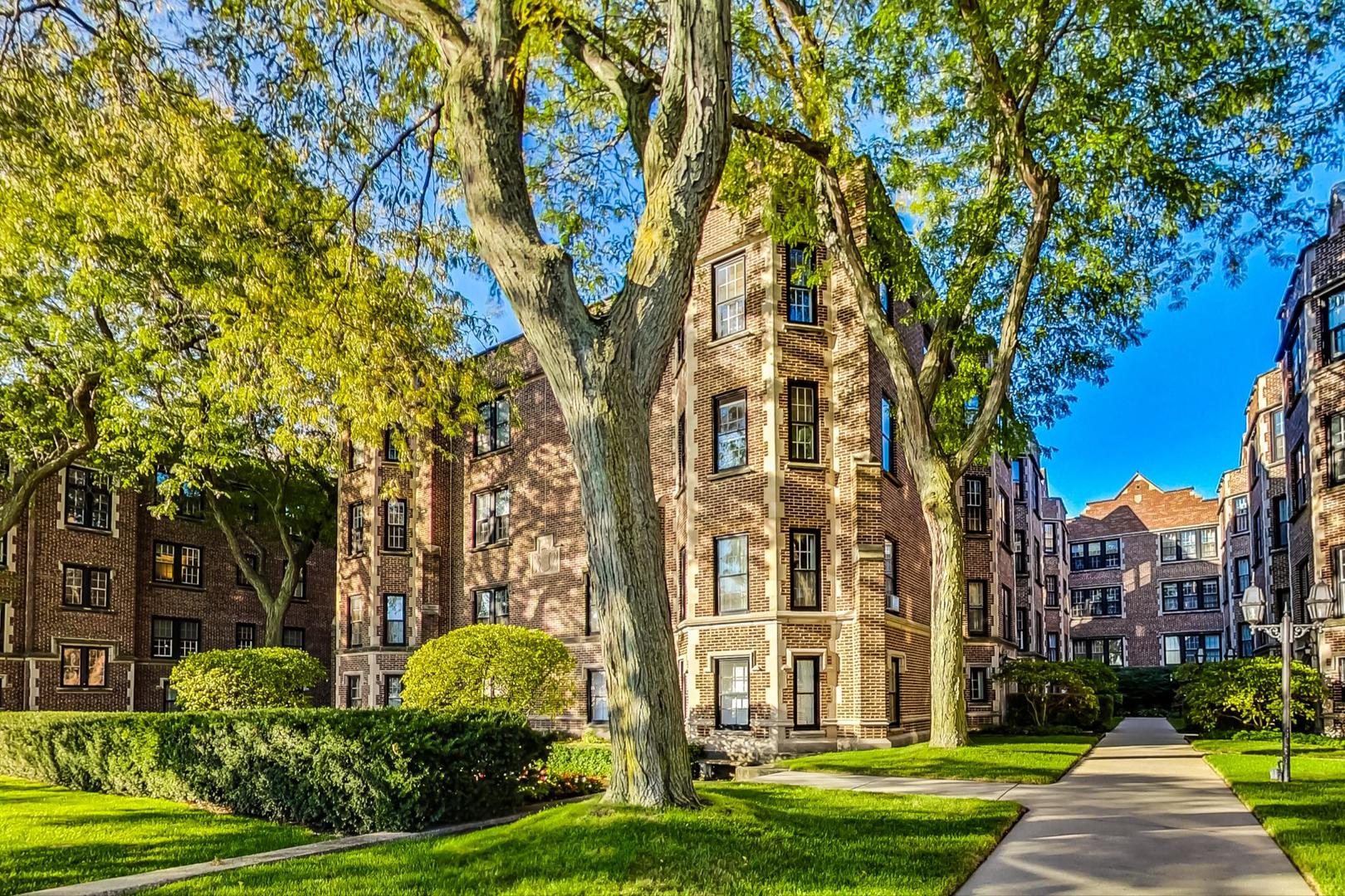 a view of a building with a yard