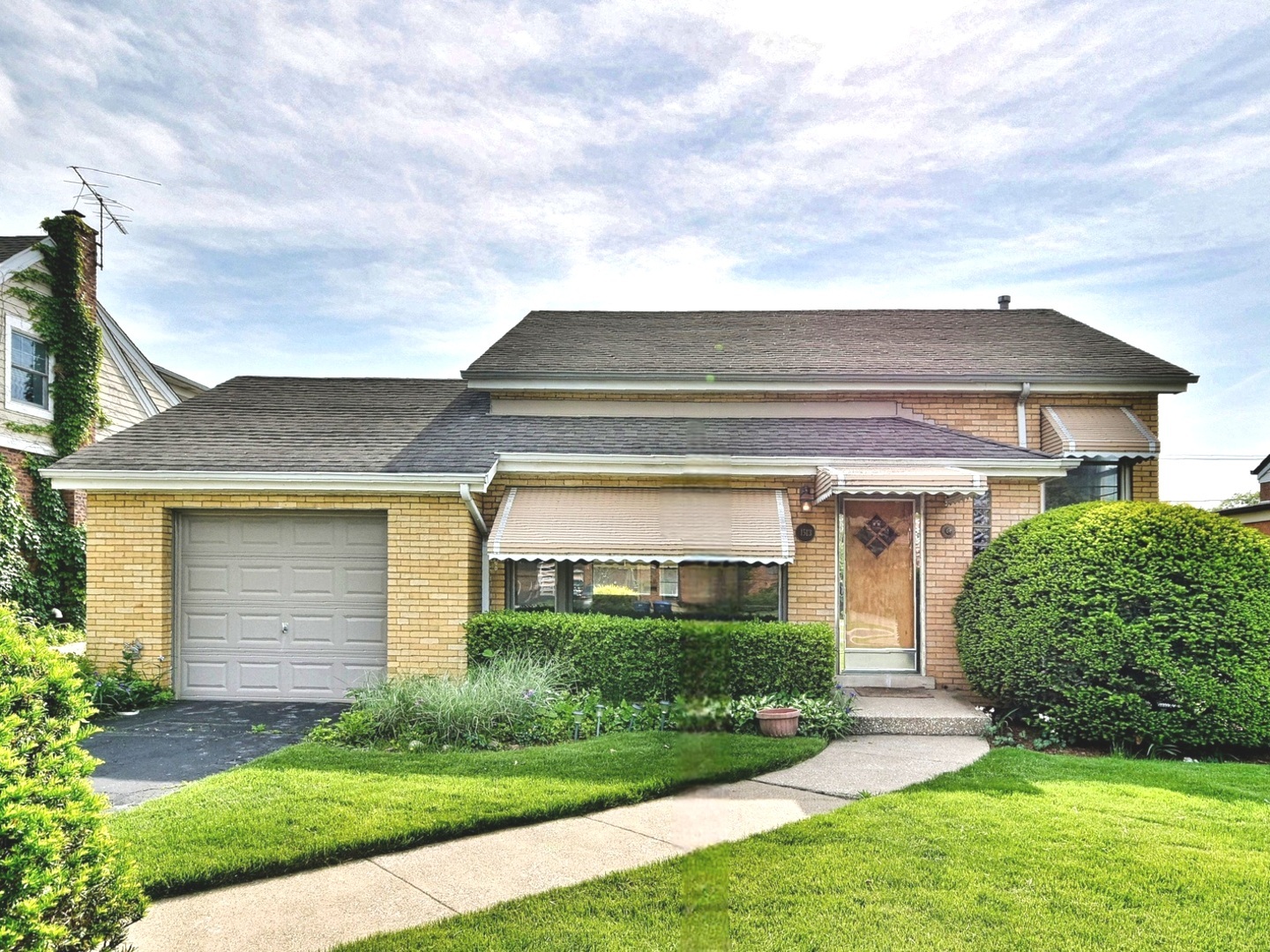 front view of a house with a yard