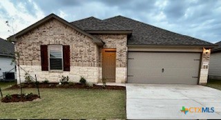 a front view of a house with garage